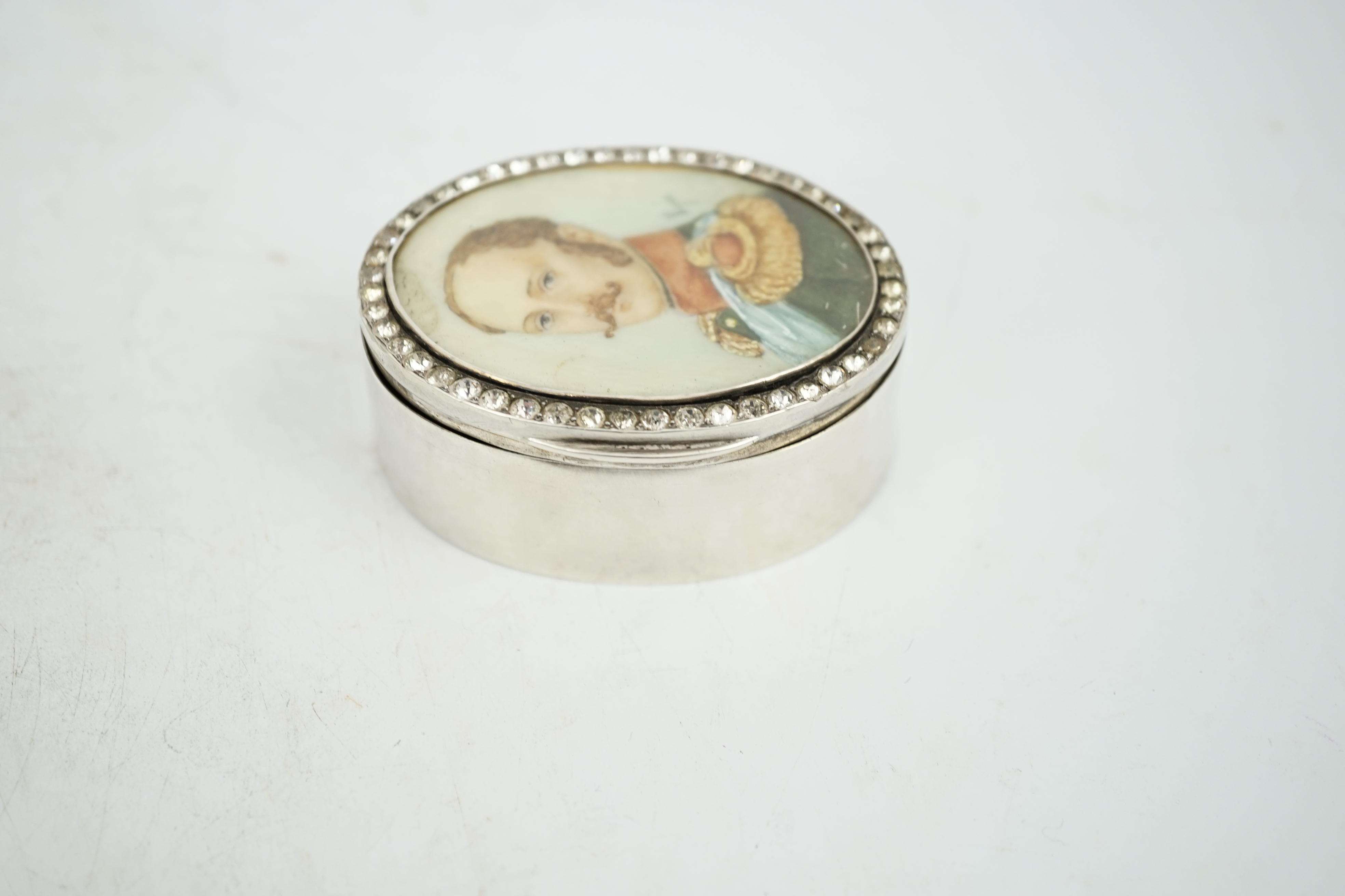 An early 20th century white metal oval snuff box